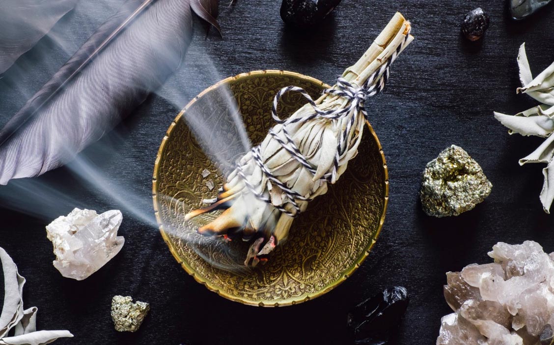 set the new moon intentions Smudging-with-white-sage